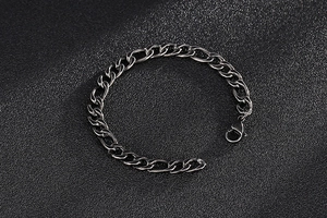 Detail of vintage gunmetal stainless steel cuban chain bracelet with lobster clasp