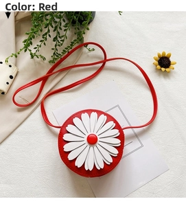 Detail of red circular kid crossbody bag with 3D white daisy flower ornament
