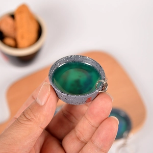 Handheld miniature ceramic wine bowl keychain with green resin and Chinese calligraphy