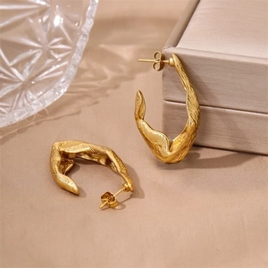 Irregular 18K gold plated stainless steel hoop earrings with unique lava texture finish