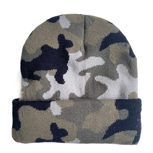 Detail of camouflage knit beanie featuring thick texture and black grey olive pattern