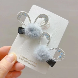 Set of two cute faux fur rabbit ear hair clips with rhinestones and black fabric wrap
