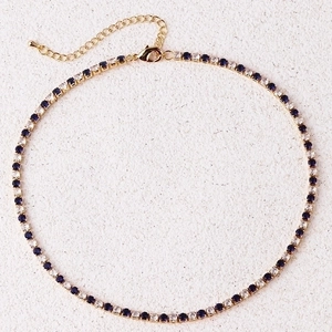Golden tennis necklace with blue and white zircon stones featuring adjustable chain