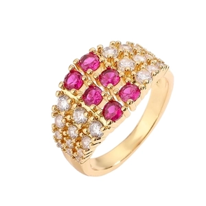 Luxurious gold-plated wide band ring with red and white pave-set zircons on white background