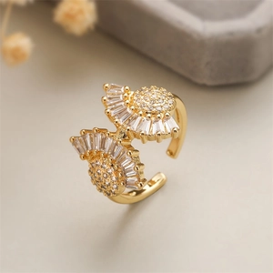 Close-up of a gold-plated copper open ring featuring micro-pave cubic zirconia in floral design