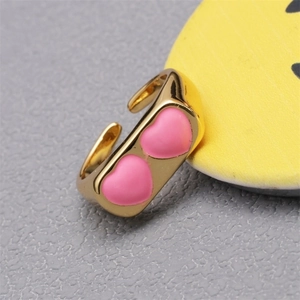 Chic golden open ring featuring dual pink heart enamel charms for women fashion