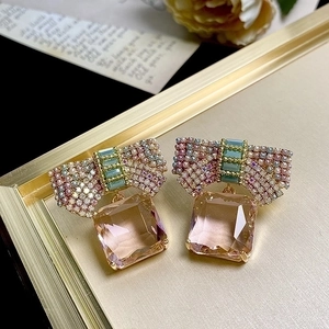 Pink bow crystal earrings with rectangular gemstone pendants in rose gold finish