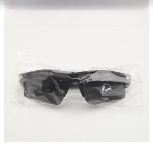 Detail of outdoor cycling sunglasses in protective packaging with explosion-proof lens sticker