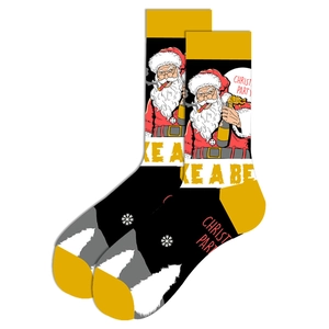 Close-up of cotton Christmas socks with Santa Claus smoking design and Christ Party text