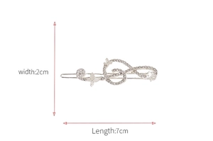 Detail view of a silver butterfly hair clip with rhinestones, 7cm length and 2cm width