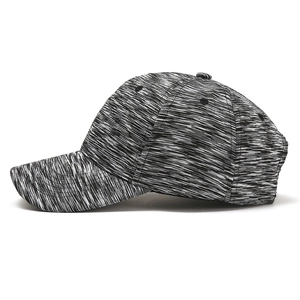 Close-up of breathable ventilation eyelets on a mottled grey cotton baseball cap