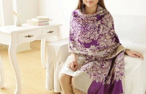 Detailed view of bohemian floral jacquard scarf with fringe and soft purple patterns