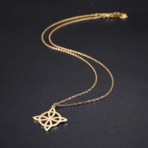 Polished gold stainless steel Viking compass pendant necklace for women on black background