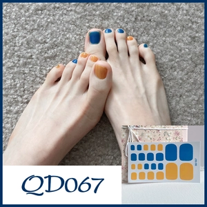 Detailed view of blue and orange QD067 toe nail stickers on model and product sheet