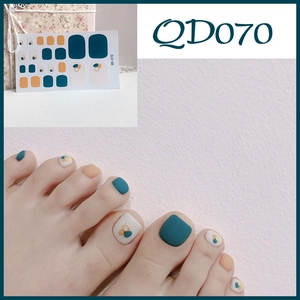 Detail of QD070 waterproof toe nail stickers in dark teal, mustard yellow, and white colors