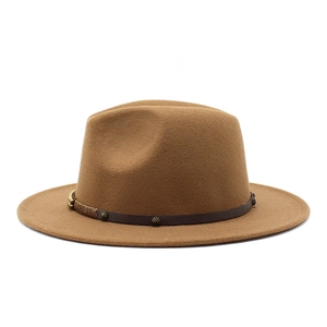 Detailed view of a tan wool fedora hat featuring a leather band with gold floral studs