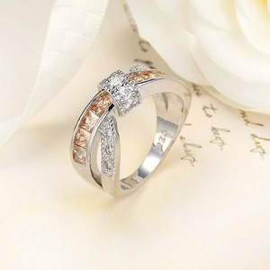 Close-up of S925 sterling silver cross ring with champagne zircon and white micro-diamonds