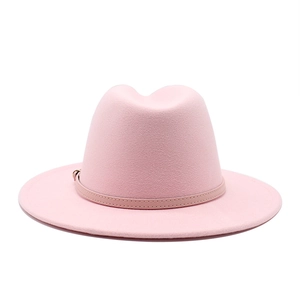 Detail of pink wool fedora hat featuring a slim leather band and golden metal buckle