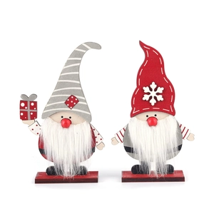 DIY Christmas wooden gnome figurines in red and grey with snowflakes and faux fiber beard