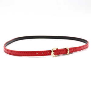 Close-up of red leather belt featuring a classic gold semicircular buckle and stitching