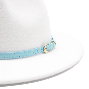 Detail of white wool fedora hat featuring a light blue band and gold metal horseshoe buckle
