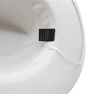 Close-up of wool jazz hat interior with 65% cotton sweatband and care label details