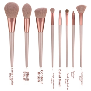 Detail view of 8-piece pink makeup brush set with rose gold ferrules and purple bristles