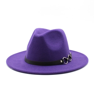 Detail of deep purple fedora hat with black leather band and silver metal buckle
