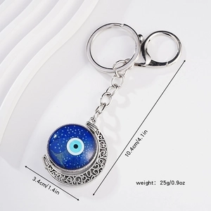 Evil eye moon keychain with blue glass pendant and ornate silver finish hollow frame