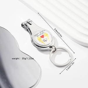Silver nail clipper keychain with memorial charm and product dimensions display