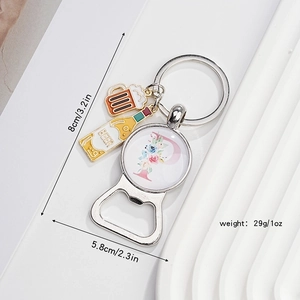 Detail showing bottle opener keychain with floral letter P and beer charms, 8cm size