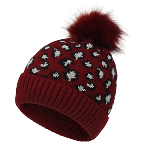 Detail of burgundy leopard knit beanie with fluffy faux fur pom pom and ribbed cuff