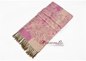 Close-up of vintage grape jacquard pattern and handmade tassels on purple shawl