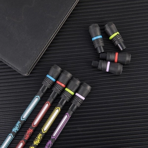Close-up of four colored spinning pens for beginners on a dark textured desk mat