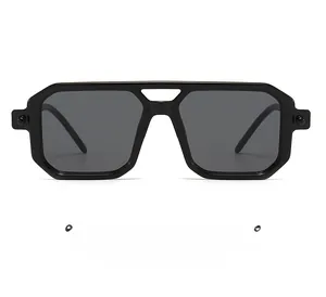 Close-up of retro double-bridge geometric sunglasses with durable black frames and dark lenses