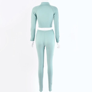Back view of mint green tight sports set featuring long sleeve top and high waist pants