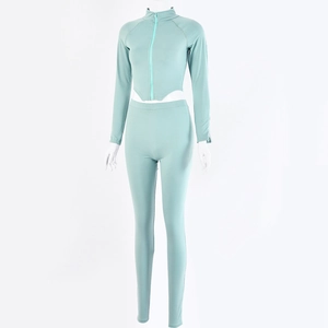 Detail view of light blue ribbed fabric on athletic two-piece set with full zip