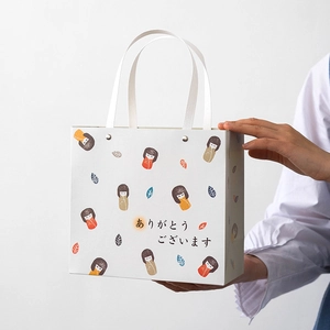 Minimalist white paper gift bag with cute cartoon motifs and rivet handle details
