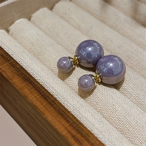 Elegant French vintage lavender double pearl earrings with gold base in a wooden jewelry box