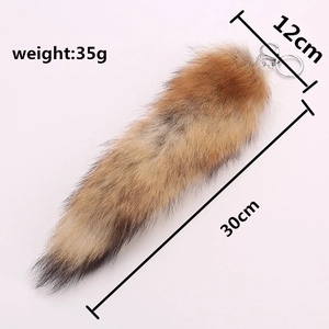 Macro view of fox tail keychain with size info: 30cm length, 12cm width, 35g weight