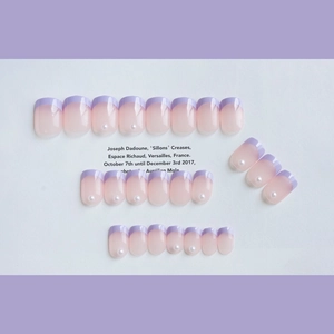 Lavender French style press-on nails set with pearl accents on a white textured card