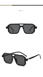 Macro detail of retro double-bridge polygon sunglasses with silver metal hinges and dark lenses