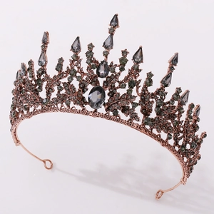 Detail of rose gold bridal tiara with grey rhinestones and hollow leaf structure