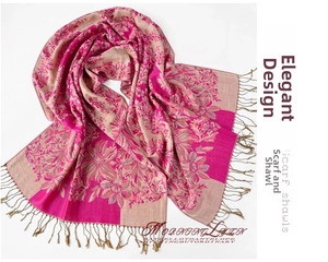 Detailed view of bohemian jacquard floral scarf with elegant fringe and silky texture