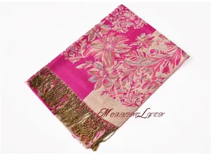 Detail of bohemian rose red floral jacquard scarf with decorative gold fringe edges