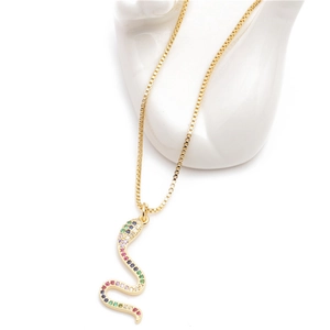 Close-up of golden box chain with a micro-paved snake pendant featuring rainbow crystals