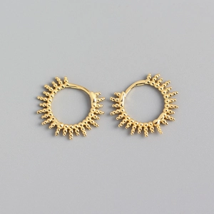 Close-up of gold S925 silver beaded hoop earrings with radial ball textures