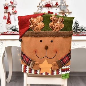 Christmas reindeer chair back cover with red fringe and plush star detail for holiday decor