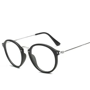 Montura de gafas redonda negra vintage con patillas de metal finas en diseño minimalista