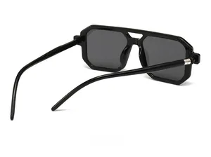 Detail view of double bridge sunglasses frame with 54-15-141 size markings on temple